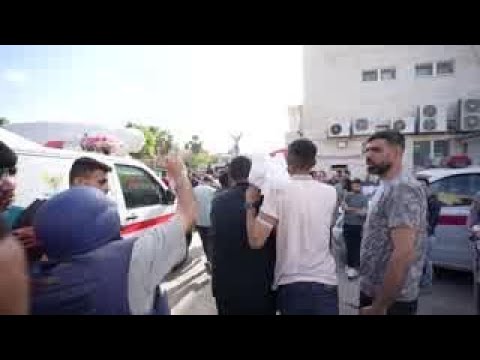 Video: Relatives carry shrouded remains of victims killed in Israeli airstrike out of hospital morgue