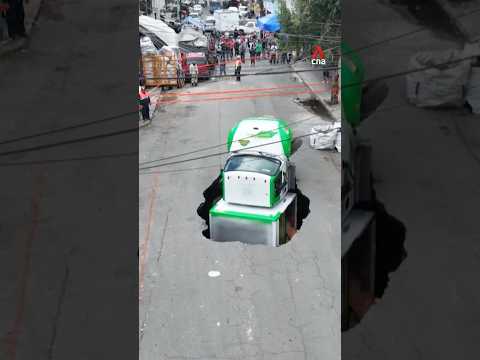 Video: Delivery truck falls into sinkhole in Mexico
