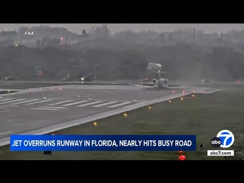 Video:  Private jet overshoots runway, stops just short of busy road