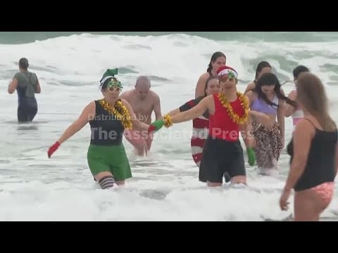 Video: Portuguese swimmers celebrate new year with plunge into the Atlantic Ocean