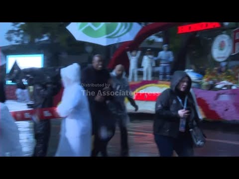 Video: Rose Parade continues as rain poured for the first time in 20 years