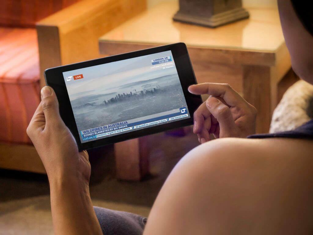 Woman watching LiveTube livestream